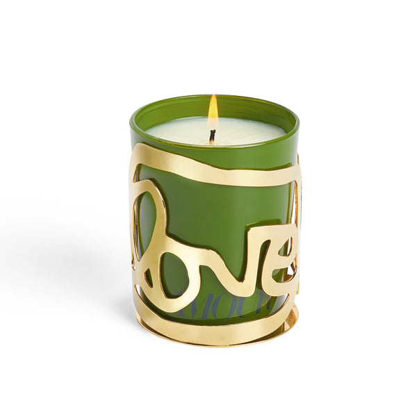 Gold LOVE candle holder around a green glass candle.